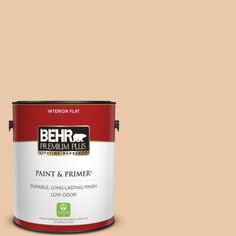 a can of behr premium plus paint and primer in one on a blue background