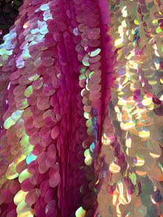 an abstract image of pink and green sequins