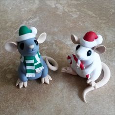 two toy mice are sitting on the floor