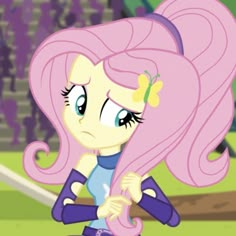 the pinkie is sitting on top of a baseball field with her hair blowing in the wind