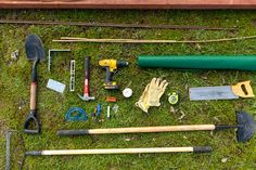 gardening tools laid out on the grass