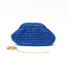 Meet our metallic blue clutch bag, its hand crochet with leather effect yarn. We specially designed it to accompany you for your special events and also make your day special 🤩 It is a perfect gift idea for women ! > It is exclusively hand crochet > It is made of ecologically colored metallic polyester yarn > It has a special metal bourse mechanism for an easy closing and stylish look. > You can choose to use it as a clutch or a crossbody bag with a metal chain strap. > Measurements are: W : 25 Trendy Blue Clutch For Formal Occasions, Trendy Crochet Pouch Bag As Gift, Blue Handmade Evening Bag For Everyday Use, Chic Crochet Pouch Bag For Evening, Chic Evening Crochet Pouch Bag, Trendy Blue Evening Clutch, Chic Blue Pouch Clutch, Chic Blue Bag For Gift, Trendy Blue Evening Bag For Party