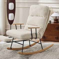 a rocking chair and ottoman in a living room