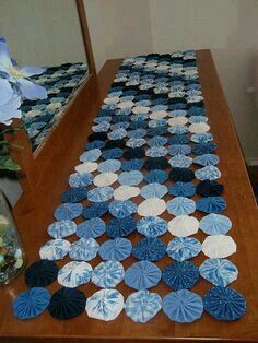 the table is covered with blue and white doily