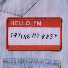 a patch that says hello, i'm trying my best on someones jeans