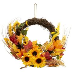 a wreath with sunflowers and other autumn flowers on it is hanging from a hook