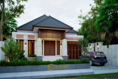 a car is parked in front of a house