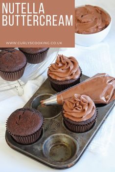 chocolate cupcakes with nutella buttercream frosting in the middle on a baking tray