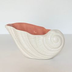 a white ceramic bowl sitting on top of a table