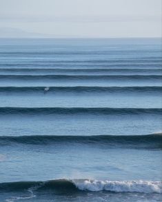 two surfers are riding the waves in the ocean