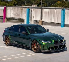 a green sports car parked in a parking lot