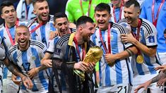 the argentina players celebrate with their trophies