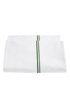 a white sheet with green stripes on the bottom and side, folded up in half