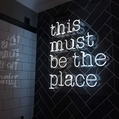 this must be the place neon sign on wall