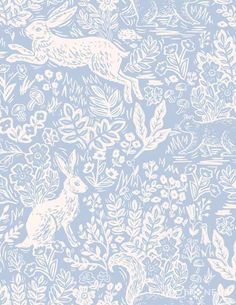 a blue and white wallpaper with rabbits