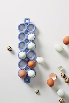 an egg tray with eggs in it next to other items