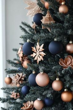 a christmas tree with ornaments hanging from it