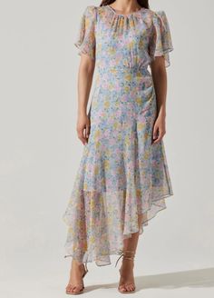 The pink and blue print on this dress is unreal. She brings the perfect mix of classy and girly while having a unique flare. She is perfect to wear as a wedding guest or for a spring/summer event!