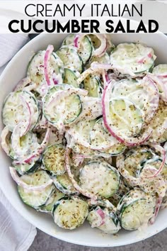 a white bowl filled with cucumber and radishes covered in ranch dressing