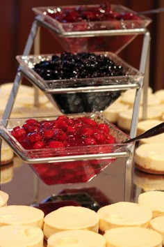 three trays filled with different types of food on top of a table next to each other