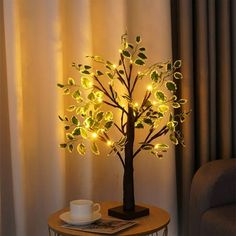 a lighted tree is sitting on a table