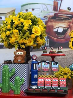 cars birthday party with yellow flowers and decorations