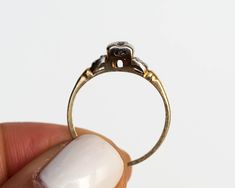 * VIEW A VIDEO OF THIS RING: https://youtu.be/wdGVWP2xDeI * Description: A mint condition ring from the art deco era circa 1930! A steal for the price, quality, and style of such a timeless jewel. A .04ct center diamond is set in 14k yellow gold and white gold. Two tone yellow and white gold metal is what makes this ring so unique! This is a true antique piece, and we are honored to offer it to our Etsy family. This ring can be sized up or down 4 sizes for an additional $30. If you wish to have 1950s Ring, Buddha Jewelry, Free People Jewelry, 1930s Art, 1930s Art Deco, Art Deco Engagement Ring, Pearl Diamond, Diamond Engagement Ring, Ring Verlobung