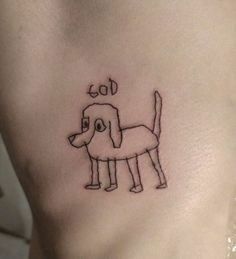 a dog tattoo on the side of a woman's stomach