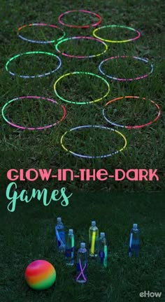 glow in the dark game is set up on grass with neon rings and bottles around it