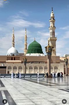 an image of people walking around in front of a building that looks like a mosque