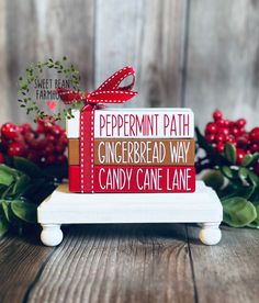 a sign that says peppermint path gingerbread way candy cane lane