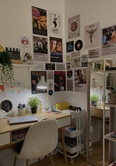 an office with posters on the wall and desk