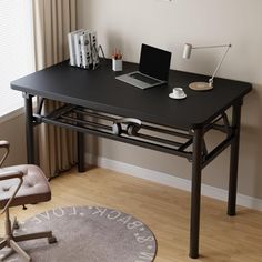 a computer desk with a laptop on it