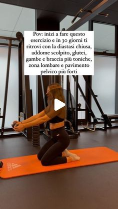 a woman doing squats on an exercise mat in a gym with the caption