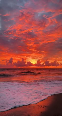 an orange and pink sunset over the ocean