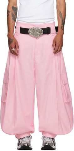 Oversized and wide-leg lightweight polyester- and cotton-blend gabardine cargo pants. · Belt loops · Four-pocket styling · Zip-fly · Pleats at front · Cinch tab at cuffs · Flap pocket at outseams Supplier color: Baby pink Baggy Pink Cargo Pants, Pink Full-length Cargo Pants, Tobi Pants, Big Pant, Pink High-waist Relaxed Fit Parachute Pants, Pink Full-length Cargo Pants With Pockets, Pink Wide-leg Parachute Pants With Cargo Pockets, Unisex Pants, Baggy Pant