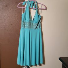 Turquoise Halter Neck Beach Dress, Casual Turquoise Sleeveless Mini Dress, Turquoise Sleeveless Beach Mini Dress, Turquoise V-neck Mini Dress For Vacation, Turquoise V-neck Summer Dress, Backless Gown, Evening Wear Dresses, Halter Top Dresses, Black Halter Dress