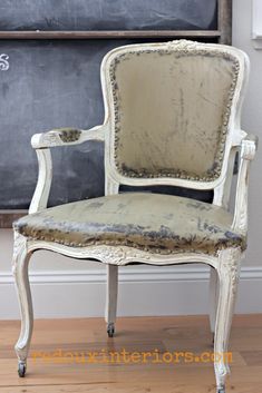 an old white chair with the words how to paint vinyl on it