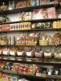 the shelves are filled with many different types of candies and candy caned treats