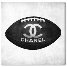 a black and white photo of a football with the word chanel on it