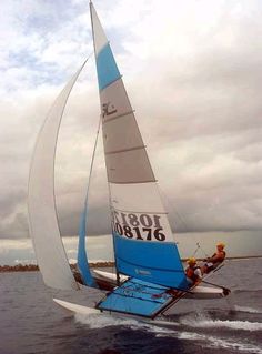 a person on a sail boat in the water