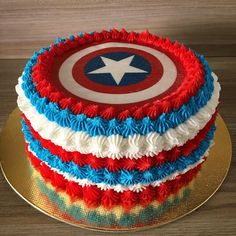 a captain america cake with red, white and blue frosting