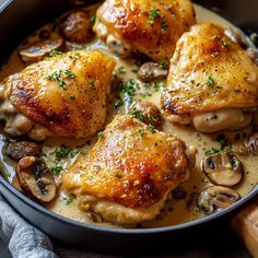 chicken with mushrooms and sauce in a pan