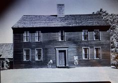 an old black and white photo of a house