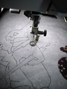 a close up of a machine with embroidery on it