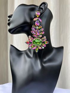 These earrings are definitely catchy and will take your outfit to the next level! They vibrant and popping are just what you need to dress up a casual look or add more pop to an already popping outfit. Comes in both fuchsia and green/pink combo. Glamorous Spring Party Earrings, Glamorous Party Earrings For Spring, Eye-catching Dangle Earrings For Party, Purple Earrings For Spring Party, Trendy Green Crystal Earrings For Gift, Multicolor Dangle Earrings For Party, Drop Earrings For Spring Party, Summer Party Dangle Crystal Earrings, Summer Party Crystal Dangle Earrings