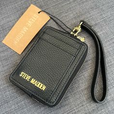 Brand New Hard To Find Steve Madden Card Case Cardholder Black Color Gold Hardware Zip Around Compartment One Id Window Three Creditcard Pockets Approximately 4.5”X 3.25”X 1” Pet & Smoke Free Home Please See My Entire Collection Trendy Black Card Holder With Card Slots, Trendy Black Coin Purse For Personal Use, Black Card Holder With Zipper Closure As Gift, Steve Madden Wallet, Yellow Wallet, Steve Madden Purse, Branded Wallets, Leather Trifold Wallet, Blue Wallet