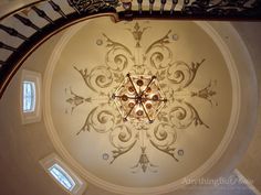 an ornate ceiling light in the middle of a room