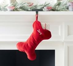 a christmas stocking hanging from a mantel