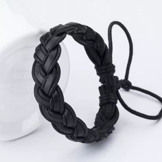 the braid bracelet is made from black leather